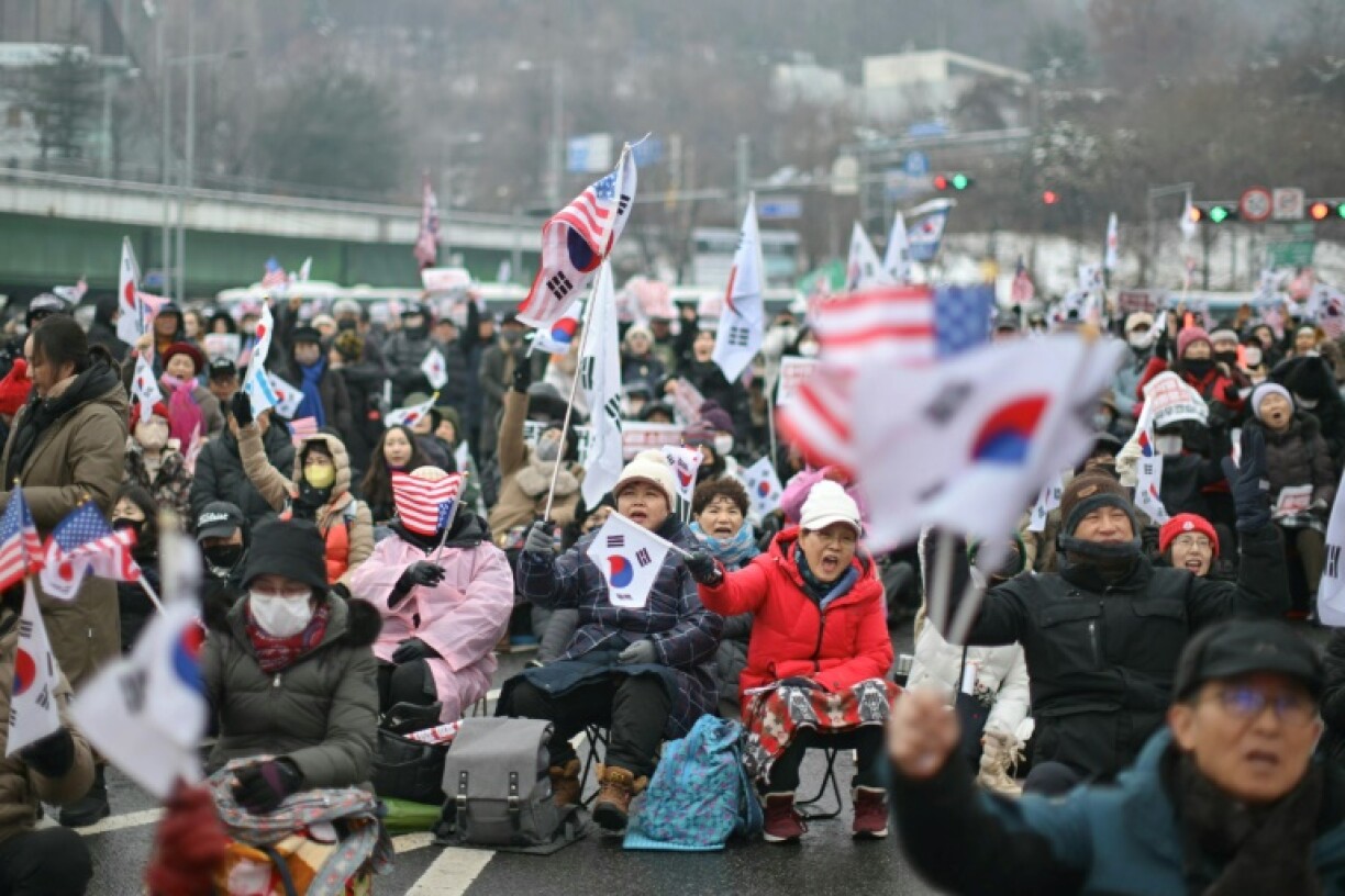 Thousands descended on his residence again Sunday despite bitter snow conditions blanketing the capital -- with one camp demanding Yoon's arrest while the other (pictured) called for his impeachment to be declared invalid