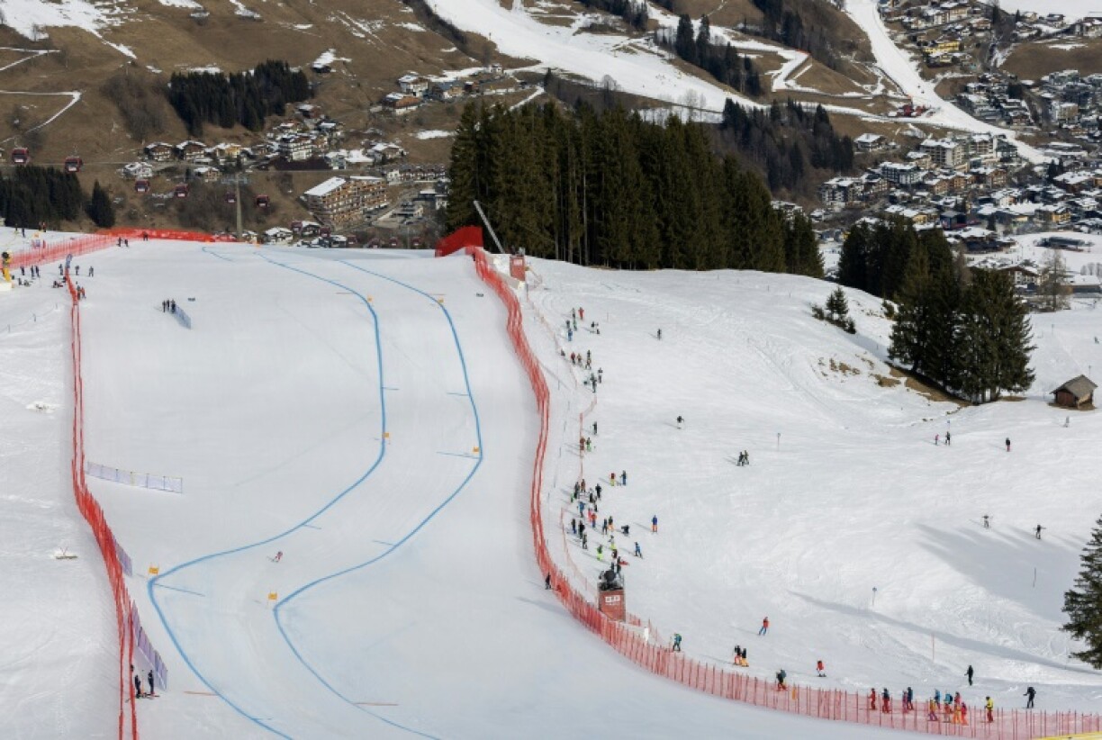 France's Karen Clement heads downhill on an artificial piste in the World Championships at Saalbach against a background of snowless mountainsides