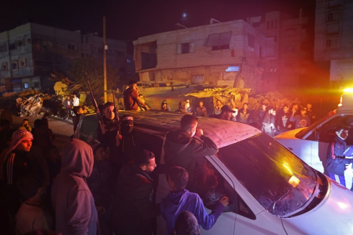 Fighters drive through Khan Yunis as Gazans celebrate news of a ceasefire deal