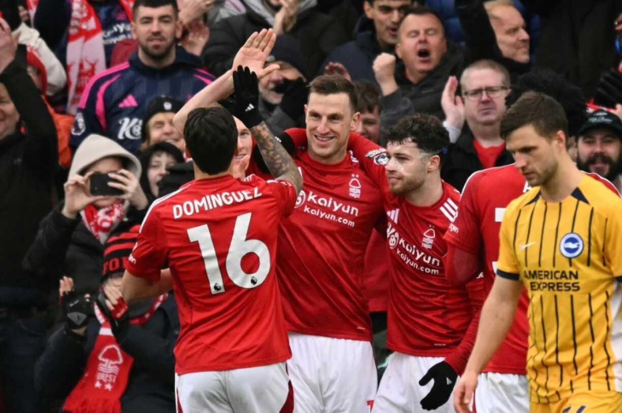 Chris Wood (centre)scored a hat-trick as Nottingham Forest thrashed Brighton 7-0