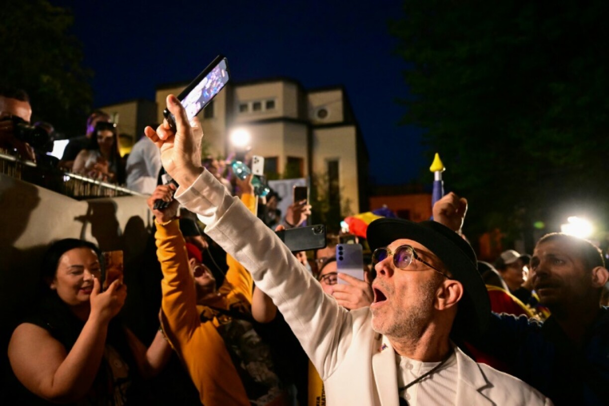 Simion's supporters celebrated when the exit poll results were released