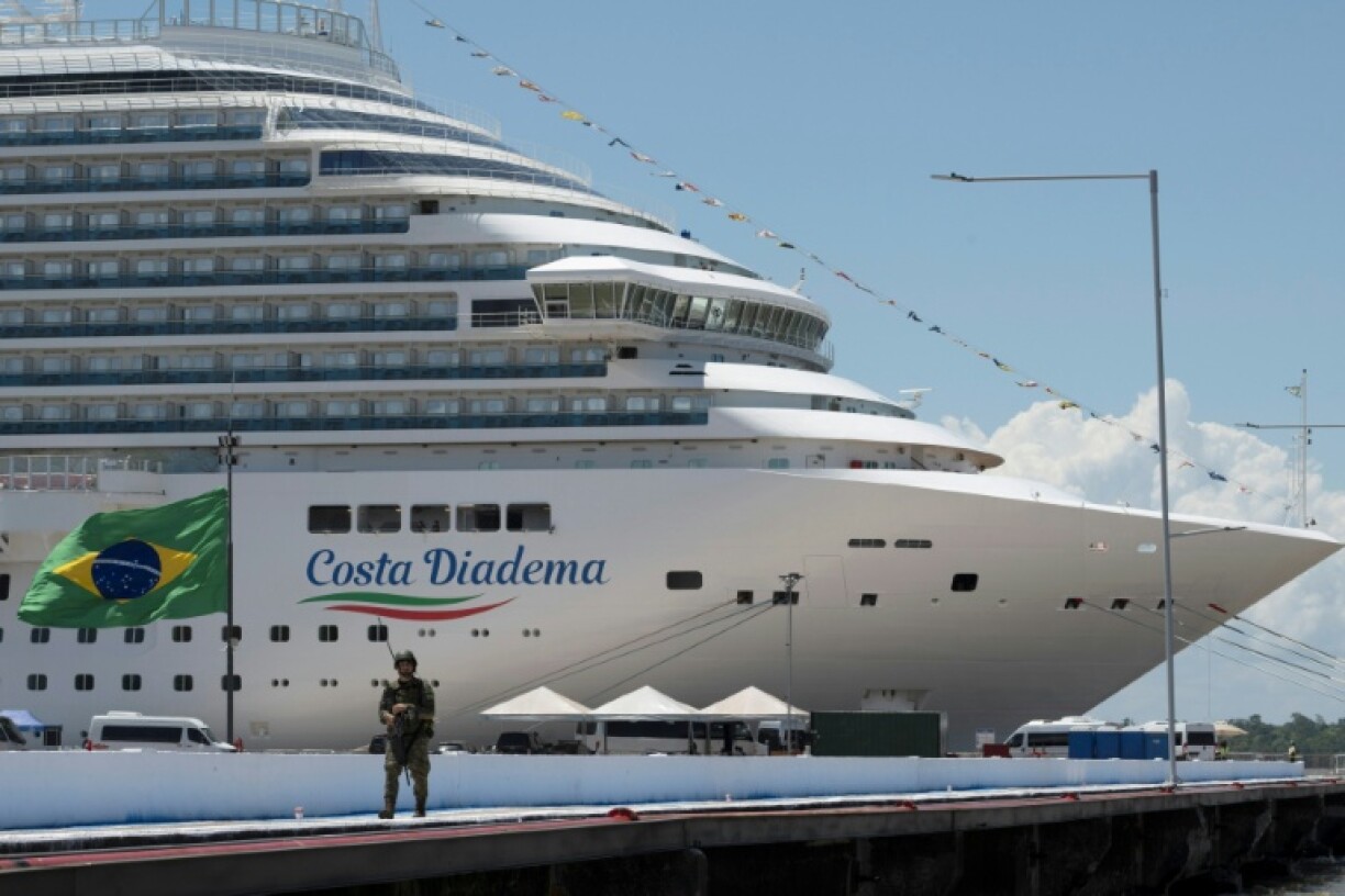 A Navy soldier patrols the Port of Outeiro, where cruise ships are docked to host delegations attending the COP30 UN Climate Change Conference in Belem, Brazil