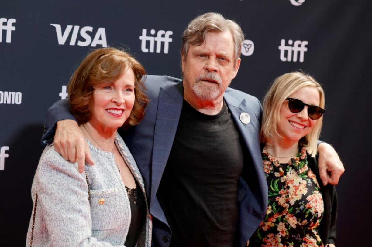 Marilou York and 'Star Wars' actor Mark Hamill (C) fled their Malibu home to escape a wildfire, seeking refugee with daughter Chelsea Hamill in Hollywood