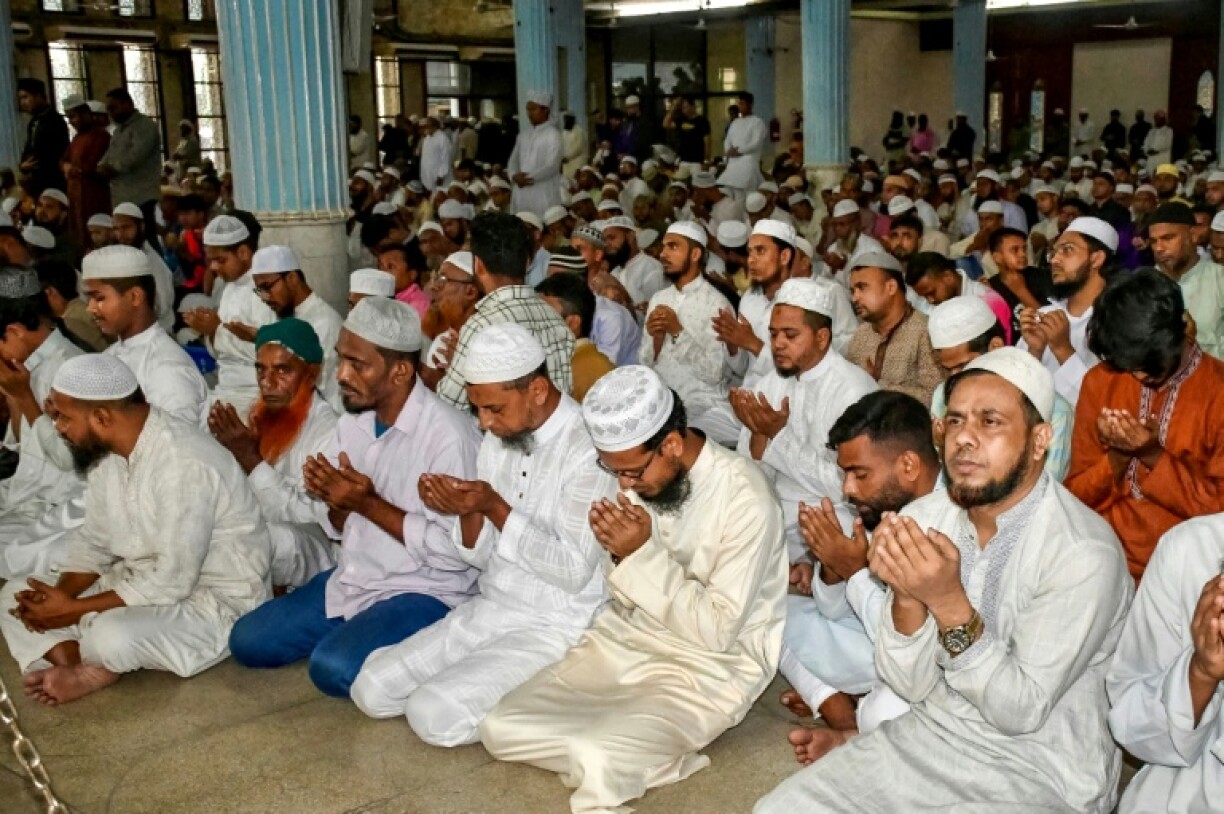 Muslims offer a special prayer at the Baitul Mukarram National Mosque in Dhaka for the victims of the plane crash