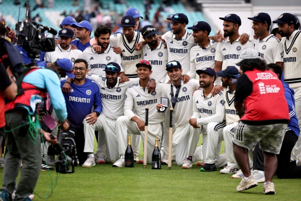 India captain Shubman Gill (3R front) poses with teammates after his side's six-run win over England in the fifth Test at the Oval