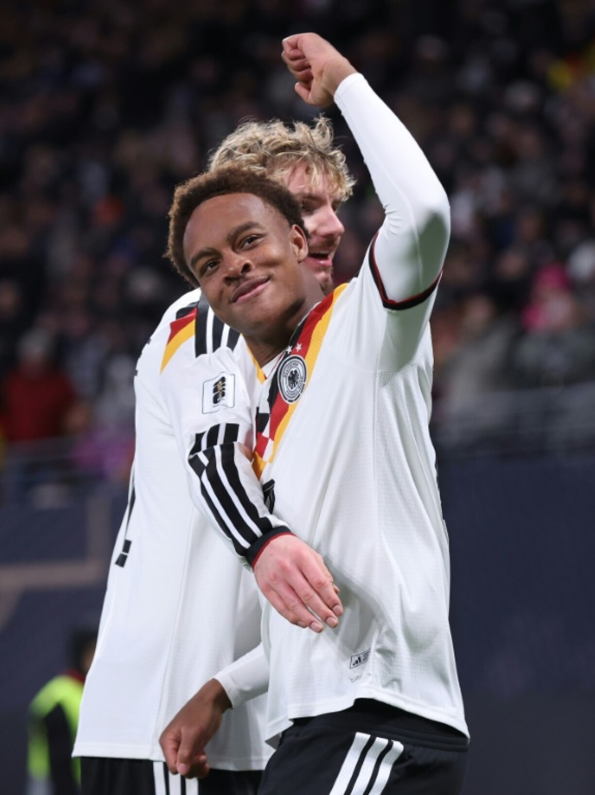 On their way: Teenager Assan Ouedraogo (front) celebrates scoring Germany's sixth goal against Slovakia