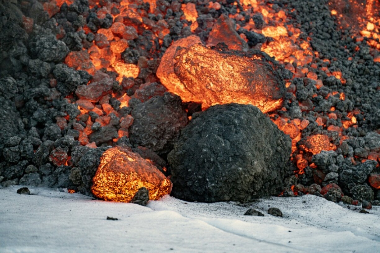 Seeping lava and gleaming white snow has proven irresistible to tourists at Mt. Etna.