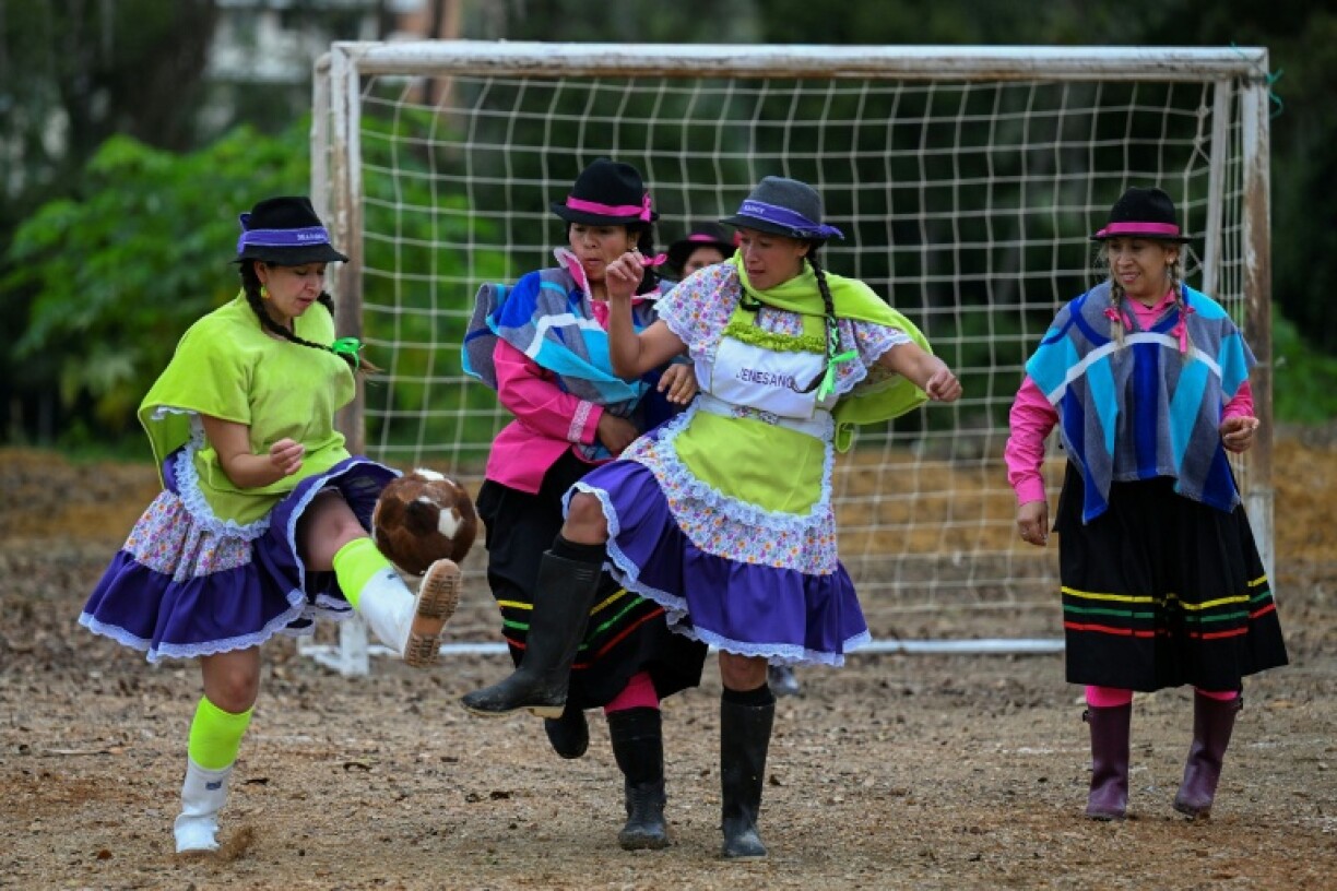 Colombian women farmers in Boyaca show off their footwork in the 'Boot, Poncho and Hat' football tournament held each August