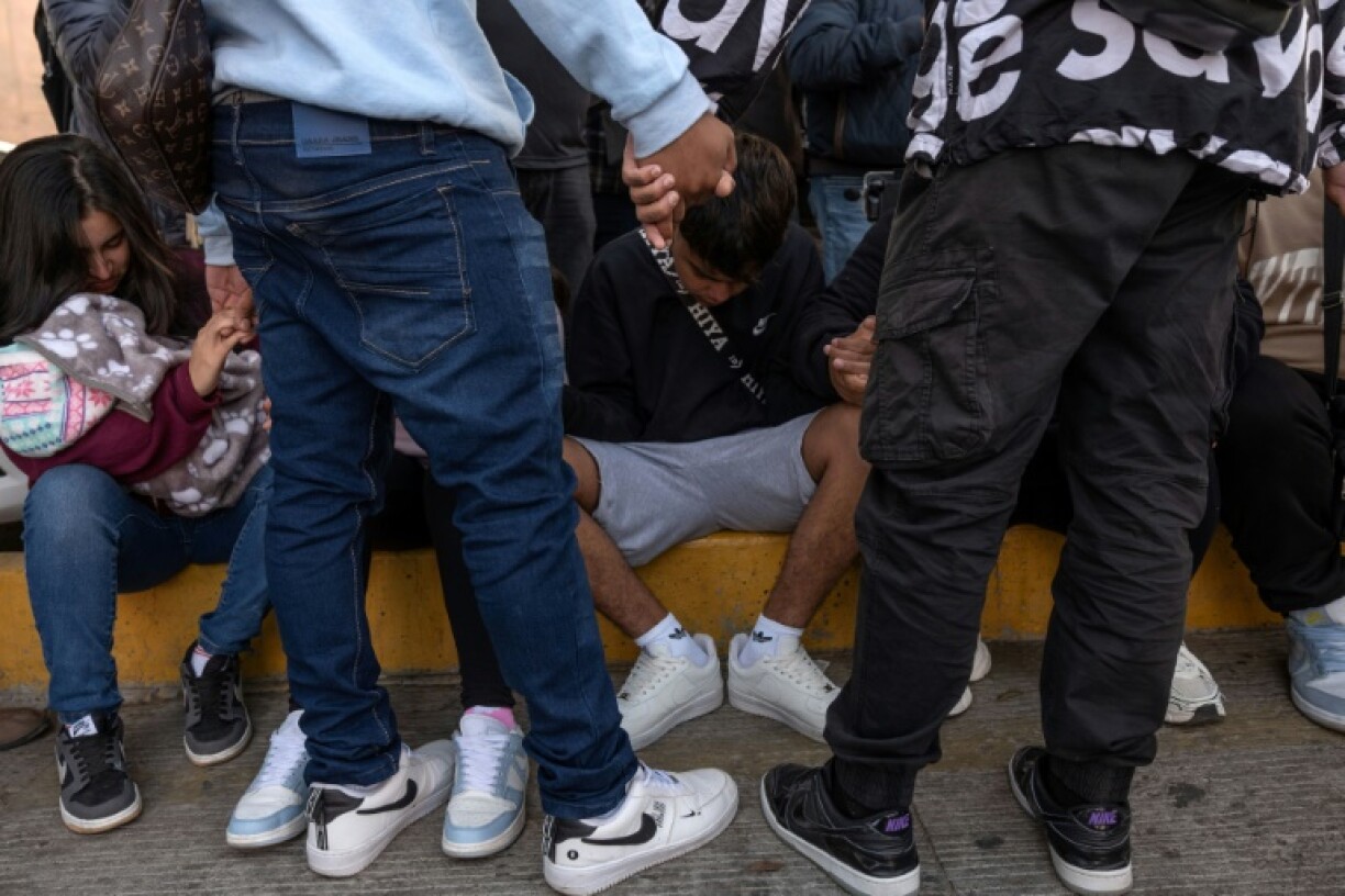 Migrants on the Mexican-US border prayed while waiting for news on their asylum appointments