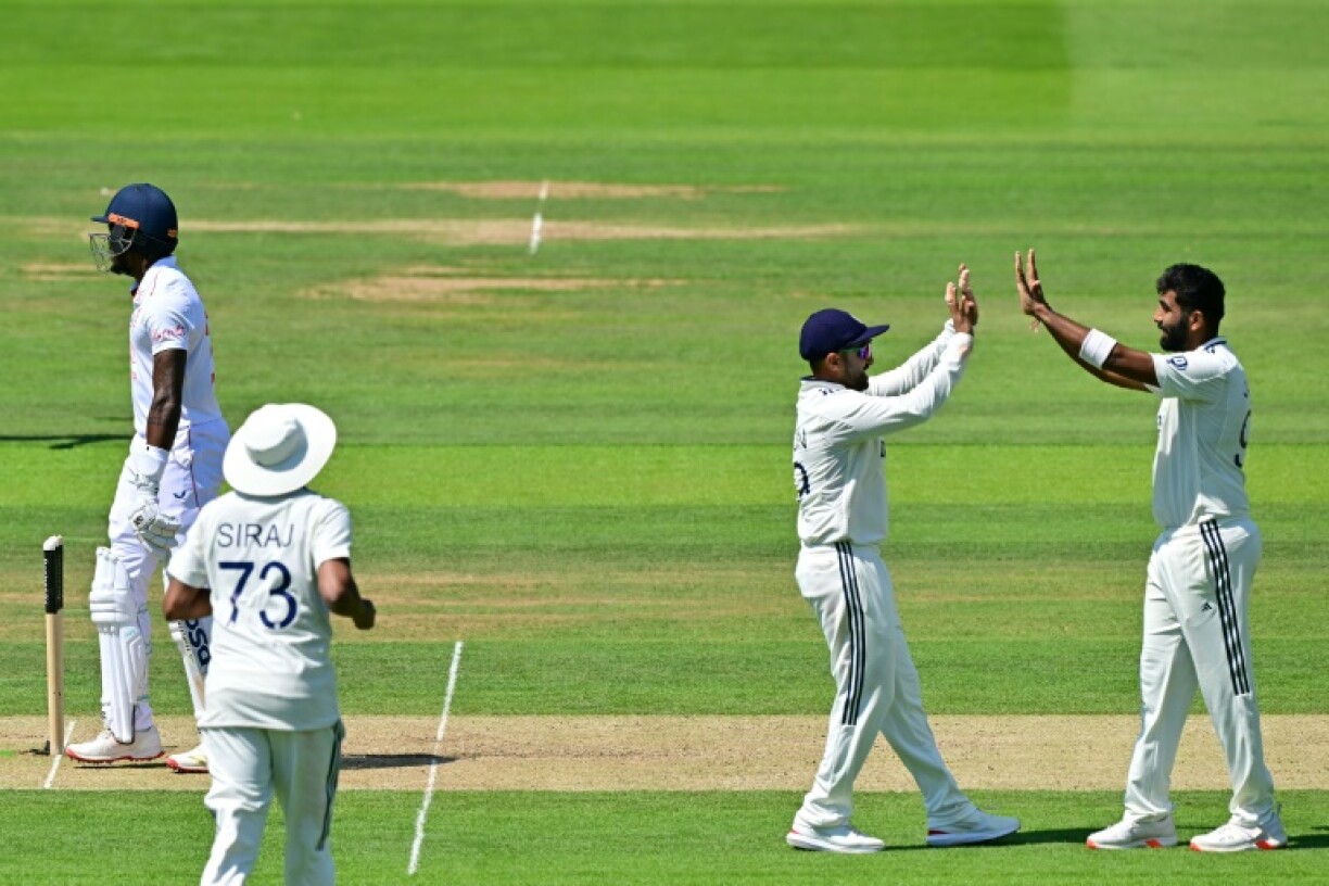 India's Jasprit Bumrah (R) celebrates with Karun Nair (2R) after dismissing England's Jofra Archer (L), his fifth wicket of the innings, in the third Test at Lord's
