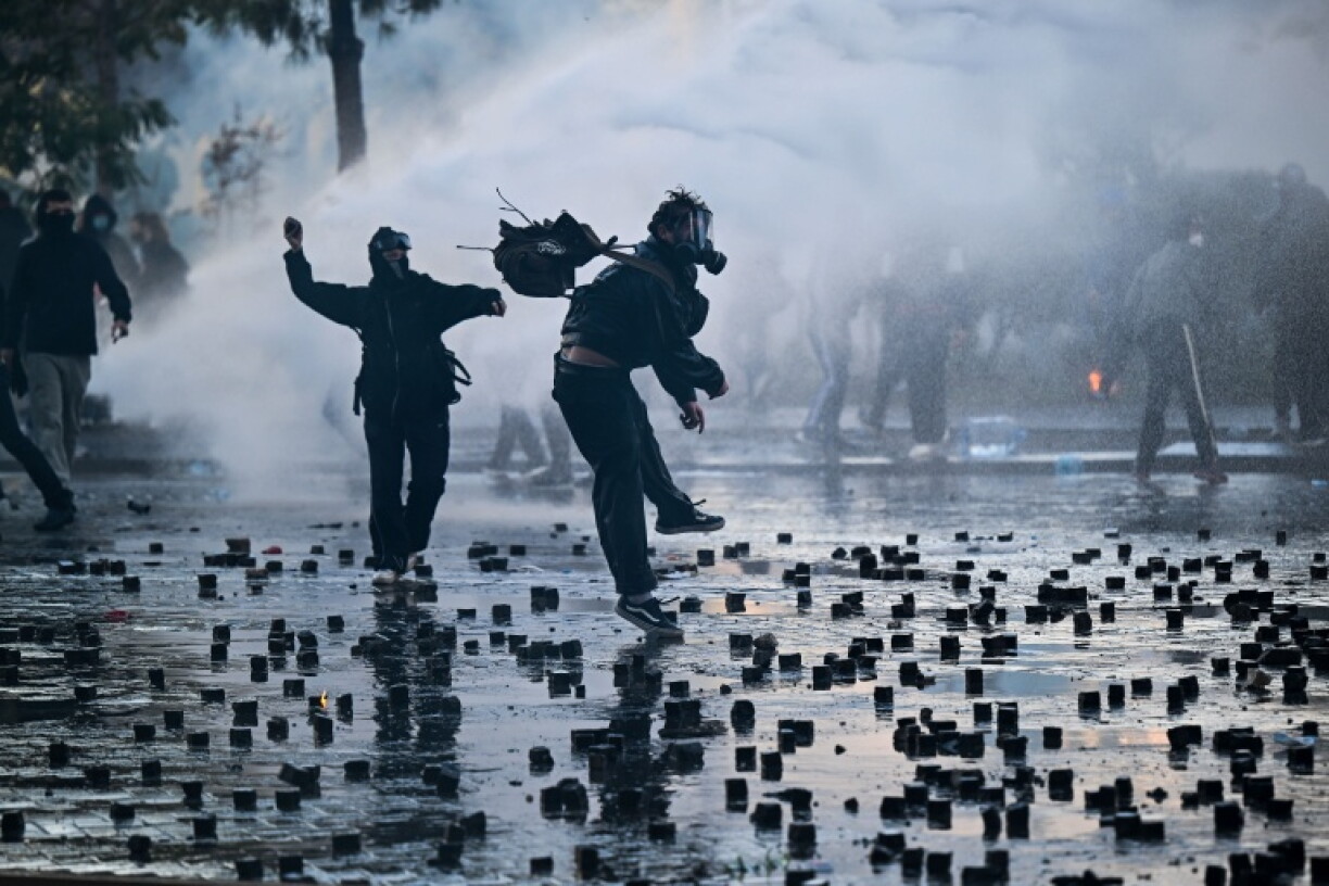 Tirana workers took up paving stones to stop them being used by anti-government protesters