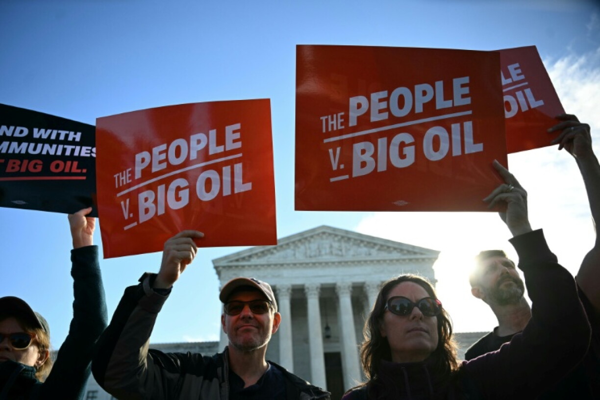 Protestors outside the US Supreme as it hears a major climate case