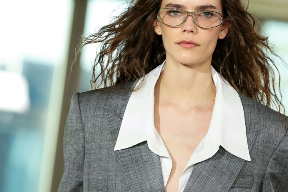 Stella McCartney presented an office-themed show... capped off with a pole dance