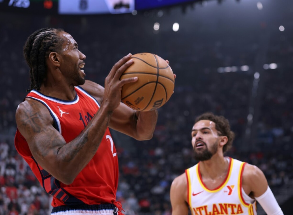 Kawhi Leonard of the LA Clippers looks to pass in front of Atlanta's Trae Young in the Clippers' NBA victory over the Hawks