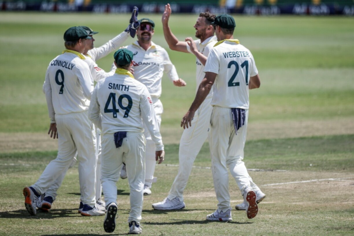 Australia's Josh Hazlewood (2nd R) celebrates taking Wiaan Mulder's wicket on day five