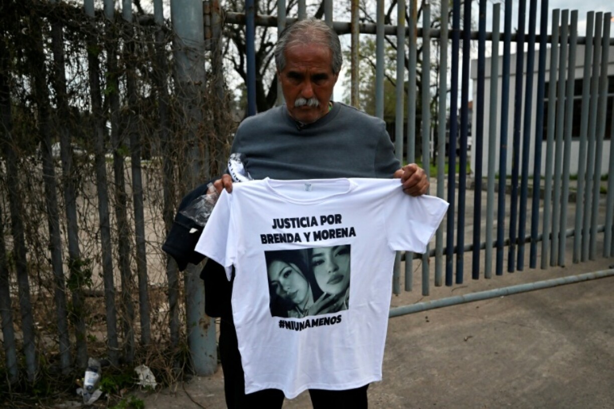 Antonio del Castillo, grandfather of Brenda del Castillo and Morena Verdi, holds a shirt demanding justice for their murder