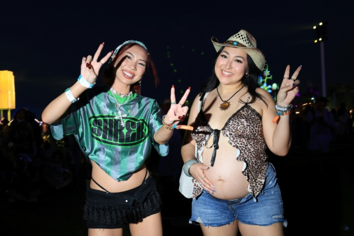 Fans of Charli XCX dance to her performance at Coachella 2025