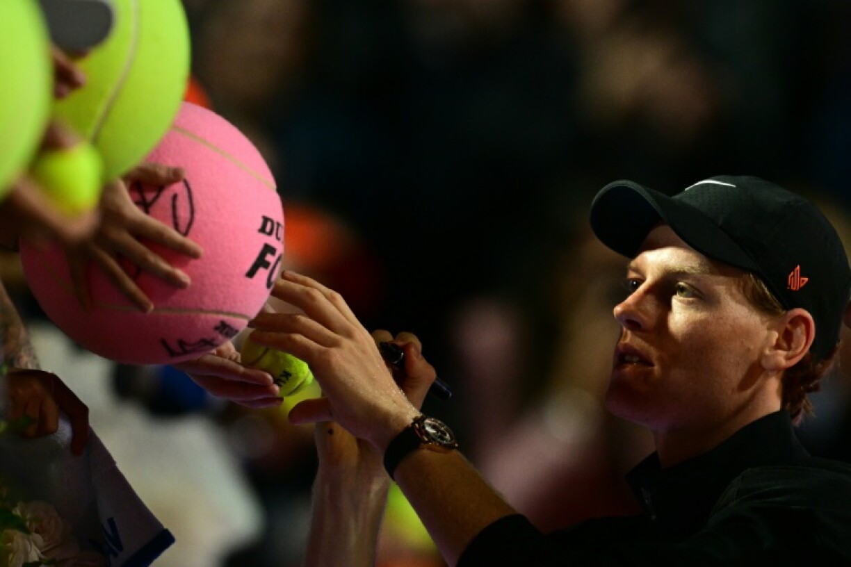 Italy's Jannik Sinner signs autographs for fans at the Foro Italico in Rome