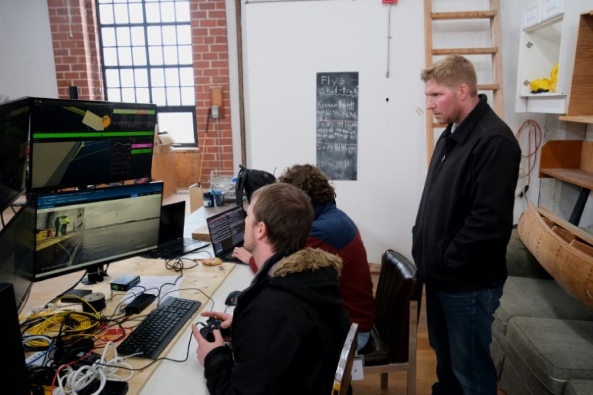 Jason Gillham, Co-Founder of Impossible Metals, inspecting the underwater launch the company's robot