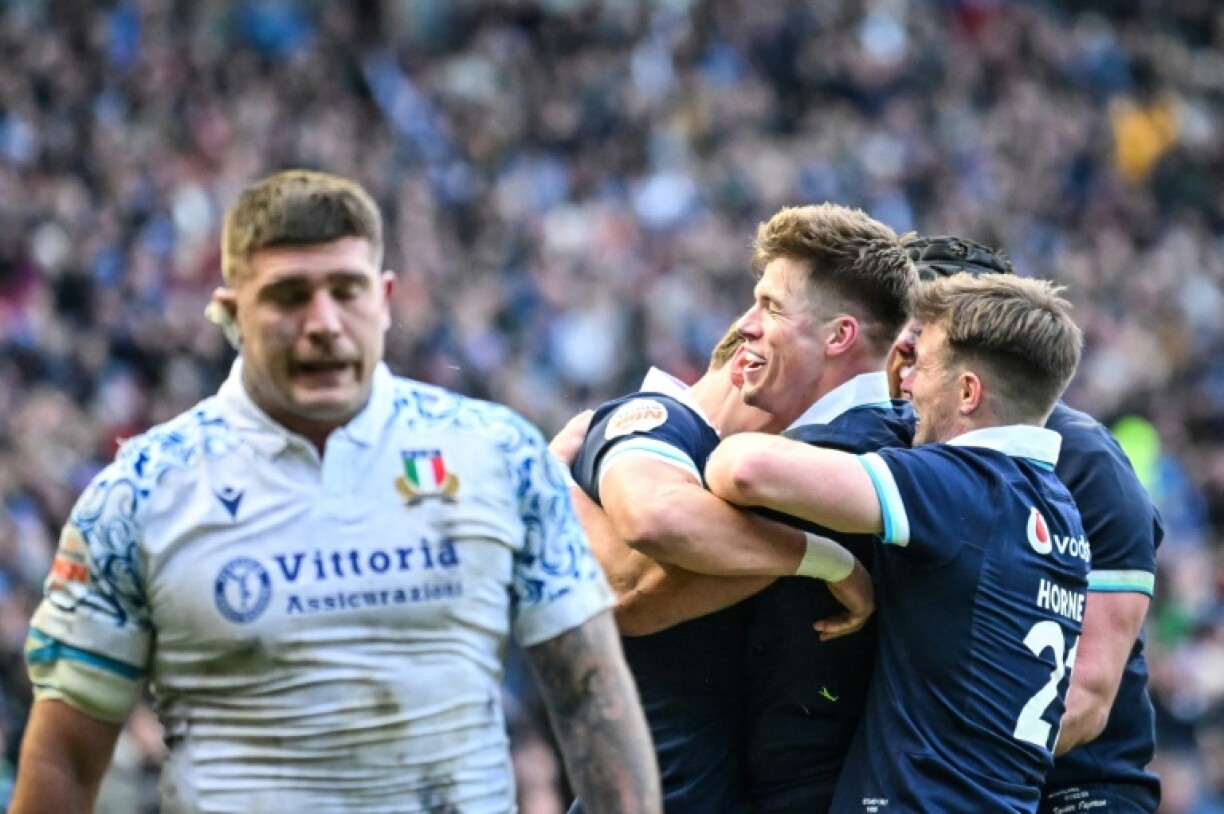Huw Jones (C) scored a trio of tries to ensure Scotland got off to a winning start in the Six Nations with a 31-19 victory over Italy