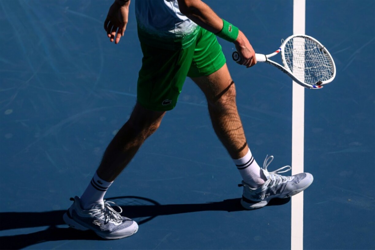 Russia's Daniil Medvedev walks with his smashed racquet during his clash with Kasidit Samrej at the Australian Open