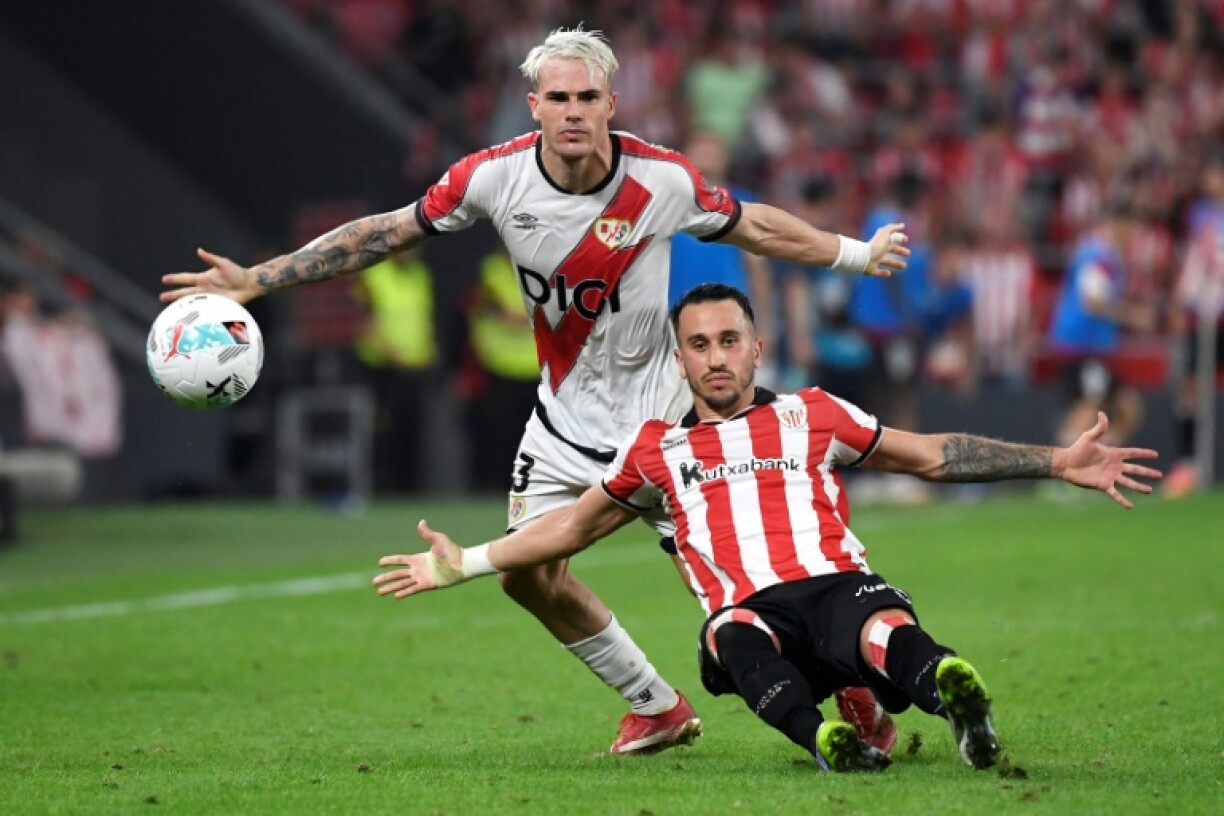 Rayo Vallecano's Pep Chavarria and Athletic Bilbao's Alex Berenguer (R) in La Liga action in Bilbao