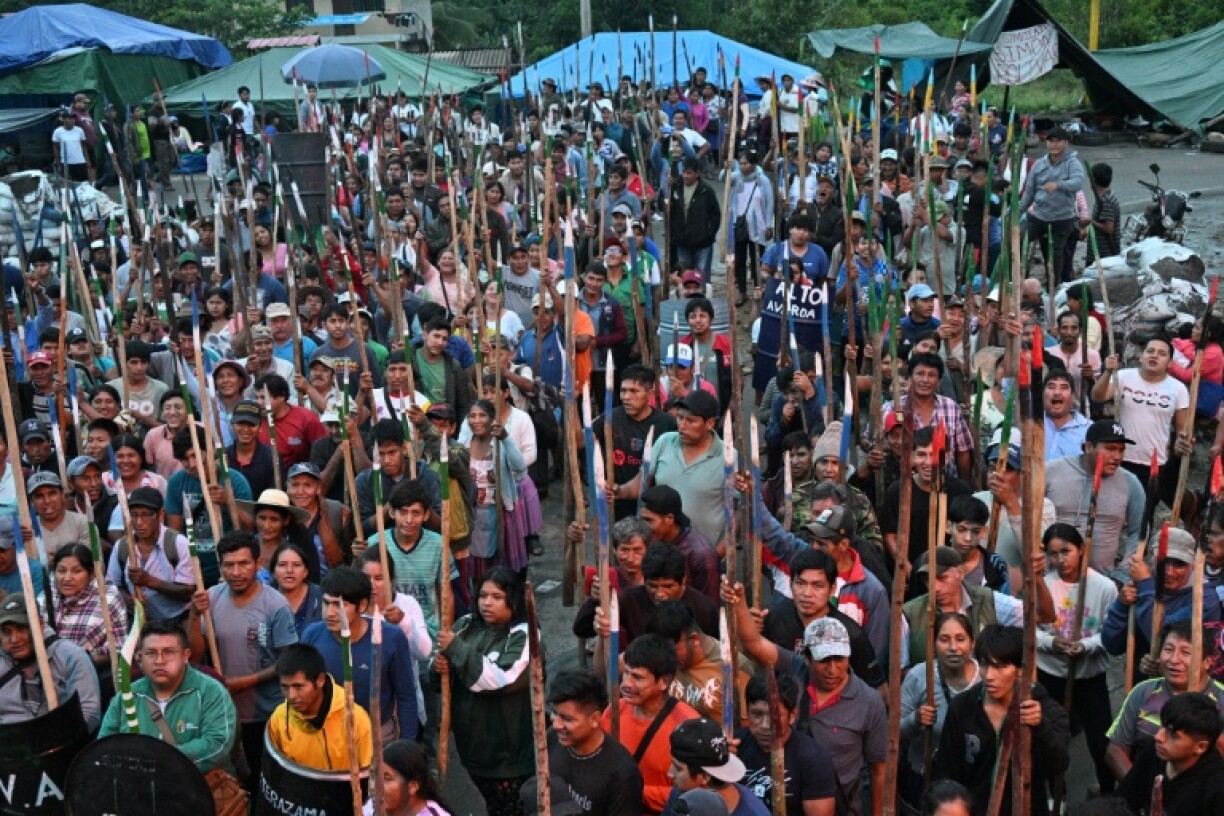 Indigenous farmers loyal to former president Evo Morales, holding wooden spears, gather in his central Bolivian stronghold of Lauca Ene to support and defend him