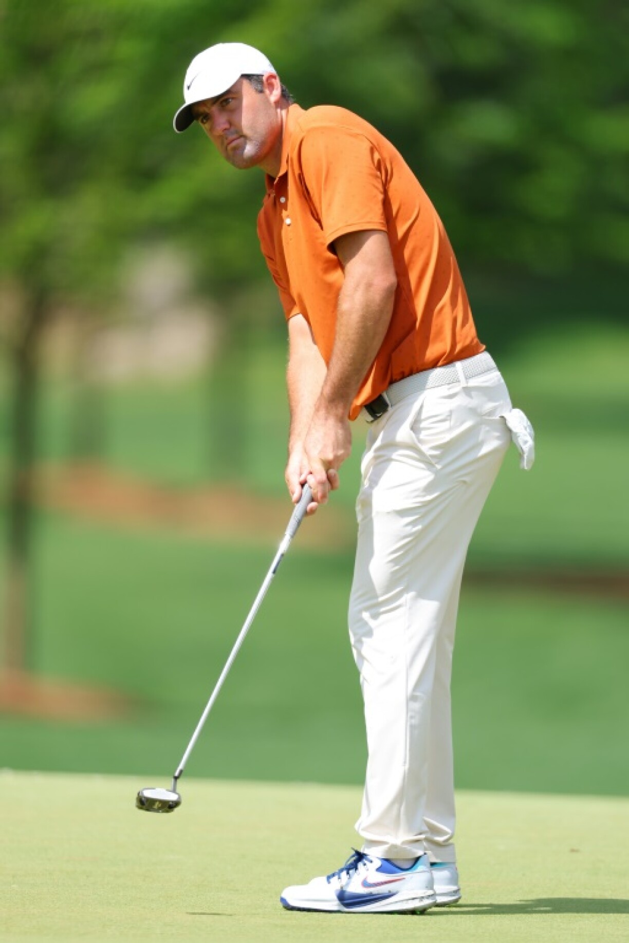 Top-ranked Scottie Scheffler of the United States practices putts ahead of the start of the 107th PGA Championship at Quail Hollow