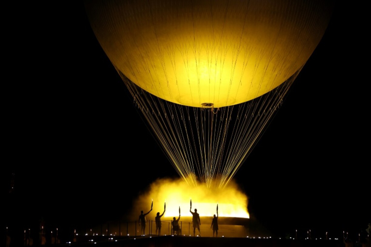 During the Paris Games, the Olympic cauldron tethered to a ballon flew into the Parisian sky at sunset every day