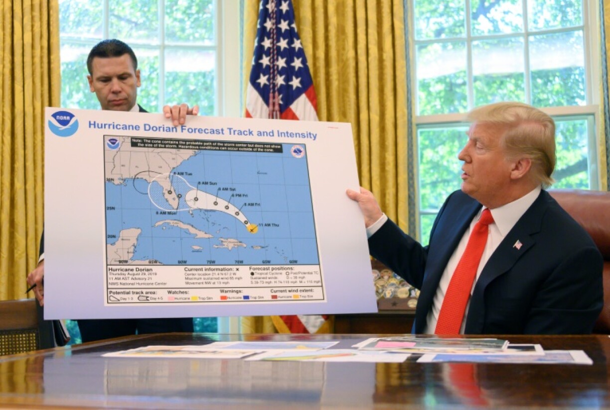 US President Donald Trump and Acting US Secretary of Homeland Security Kevin McAleenan update the media on Hurricane Dorian preparedness from the Oval Office at the White House in Washington, DC, September 4, 2019