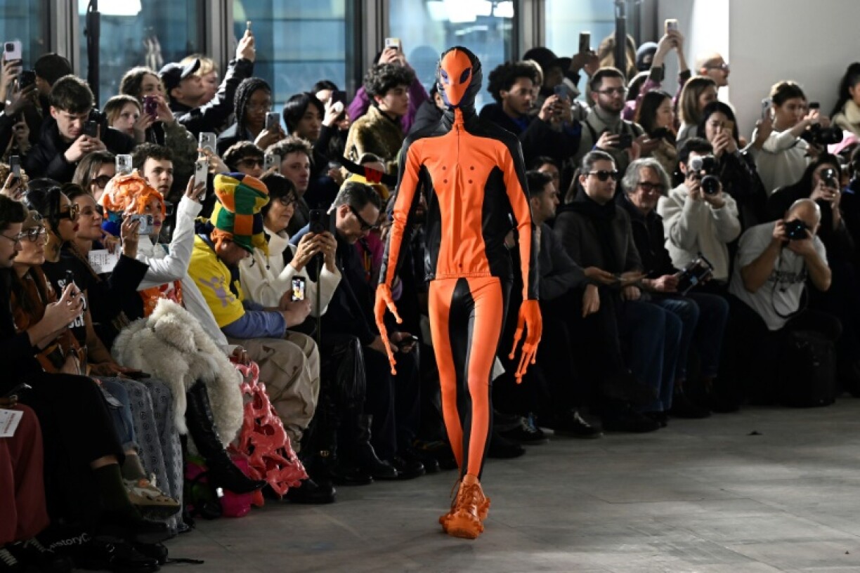 The collection featured alien motifs, including this model in an orange and black suit