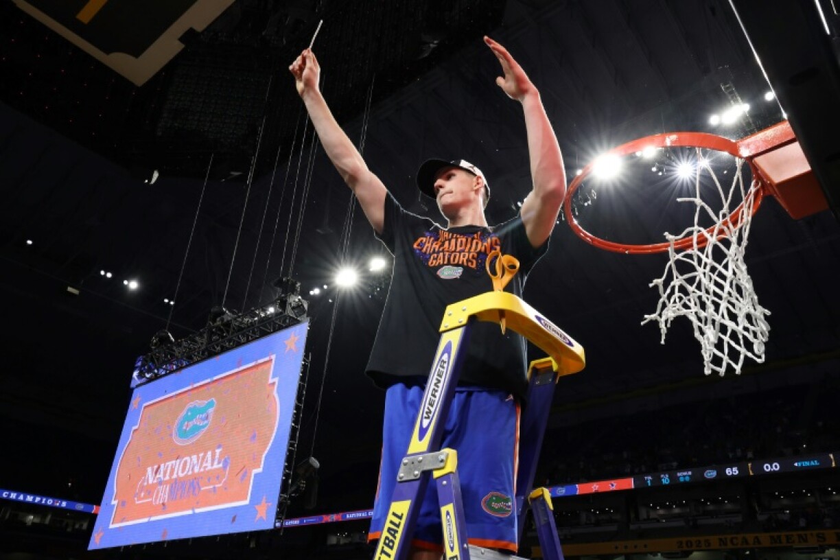 Australian big man Alex Condon celebrates a Florida Gators victory in the NCAA final last month and said he has opted out of the NBA Draft so he can return to Florida next season