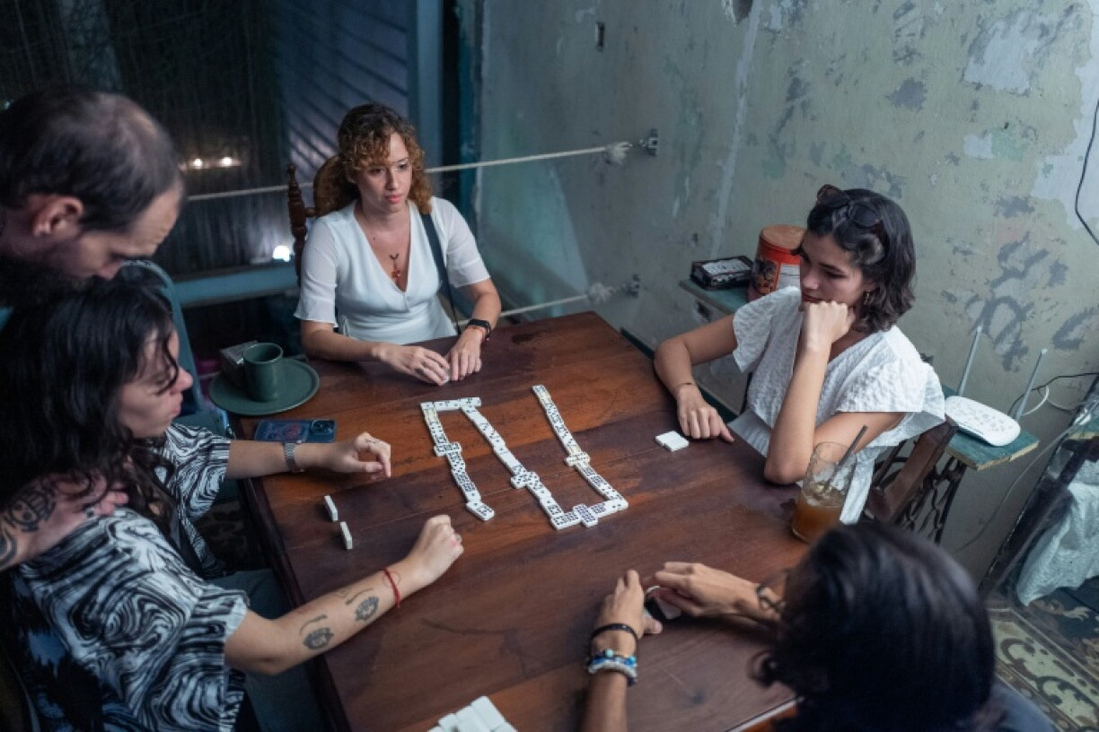 Dominoes 'keeps us united,' said 24-year-old Melanie Tejeda in Cuba