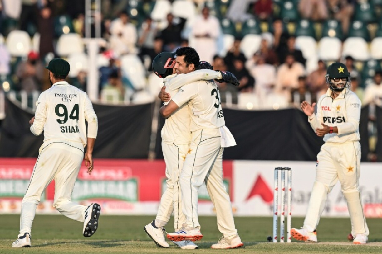 Pakistan's Asif Afridi (2R) celebrates with teammates after taking the wicket of South Africa's Dewald Brevis