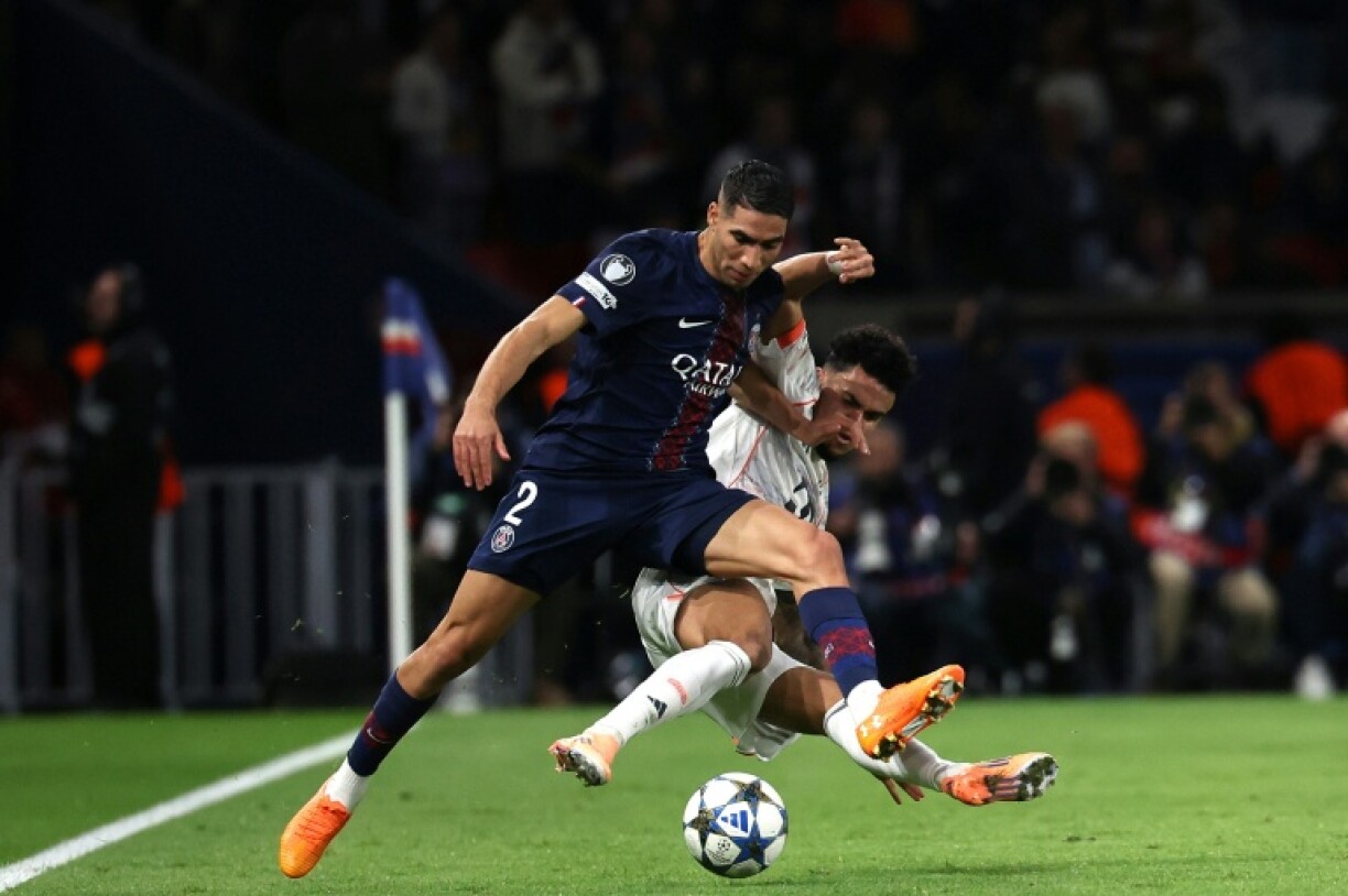 Paris Saint-Germain's Achraf Hakimi had to come off after suffering an ankle injury in a challenge with Bayern Munich's Luis Diaz