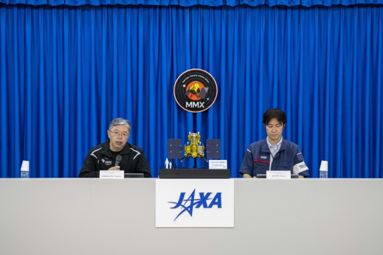 Yasuhiro Kawakatsu (L), project manager of the Mars Moons eXploration (MMX) mission, attends a press conference at the Tanegashima Space Center in Minamitane, Kagoshima prefecture on August 13, 2026