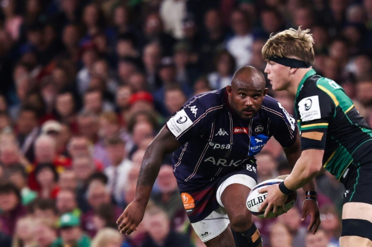 Jefferson Poirot (L) runs towards Henry Pollock in a separate incident during the Champions Cup final