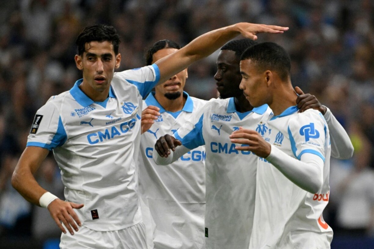 Mason Greenwood (R) set Marseille on their way to a 4-0 victory against Lorient with a penalty to open the scoring.