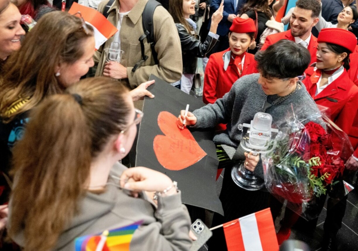 Supporters waved heart-shaped balloons and rainbow flags as his winning song played over the loudspeakers