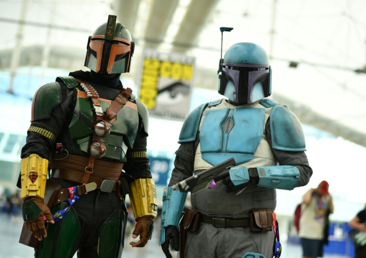 Des fans déguisés en chasseurs de primes de l'univers "Star Wars", le 22 juillet 2026 lors du Comic-Con à San Diego, en Californie