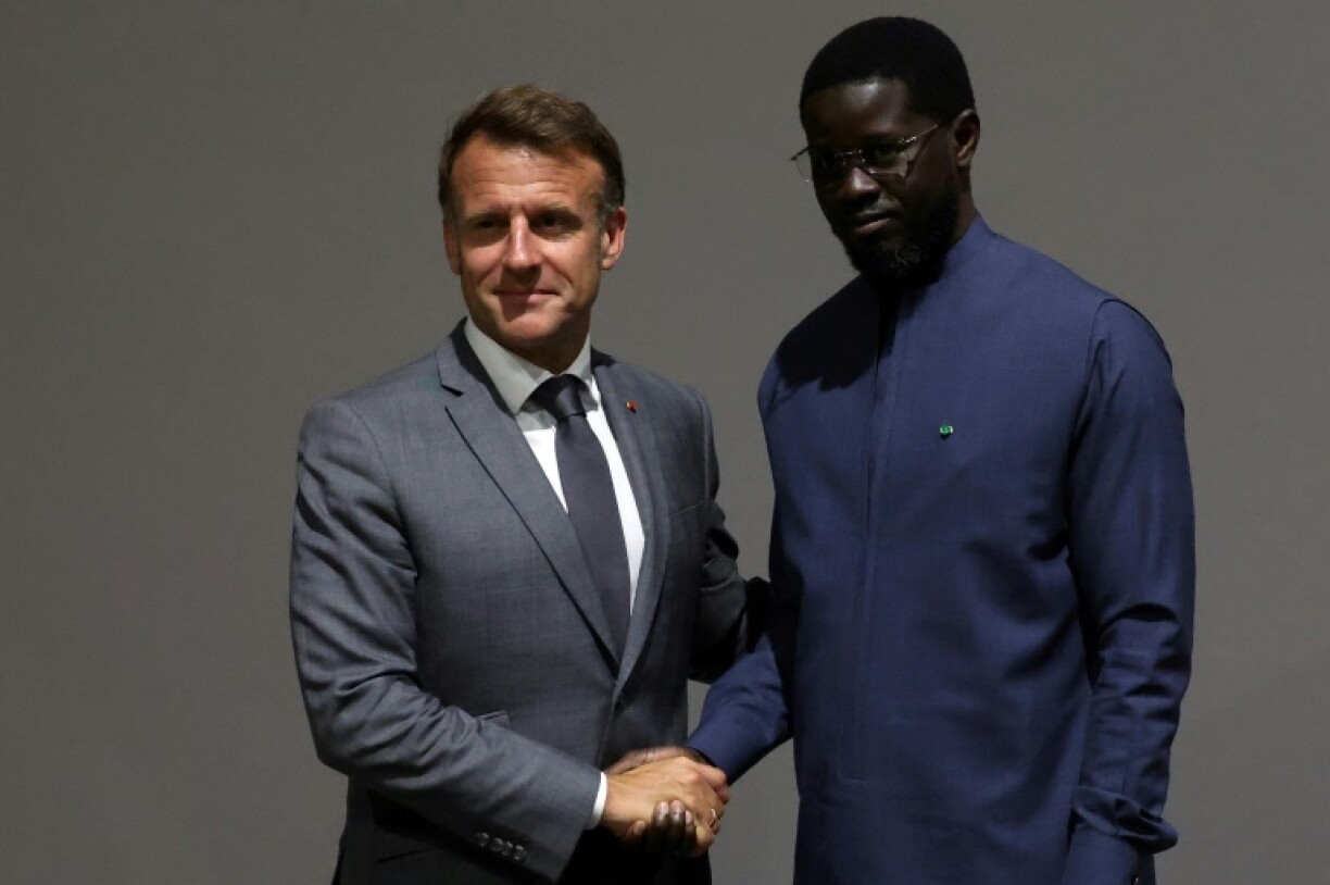 Senegalese President Faye (R) -- here with France's President Macron -- insisted French troops must go