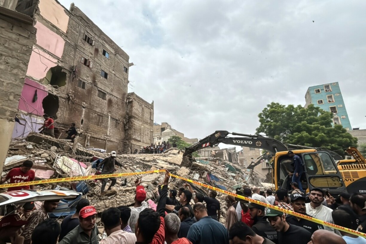 Rescuers and city residents worked together to pull people from the debris of the run down building in the mega port city of Karachi