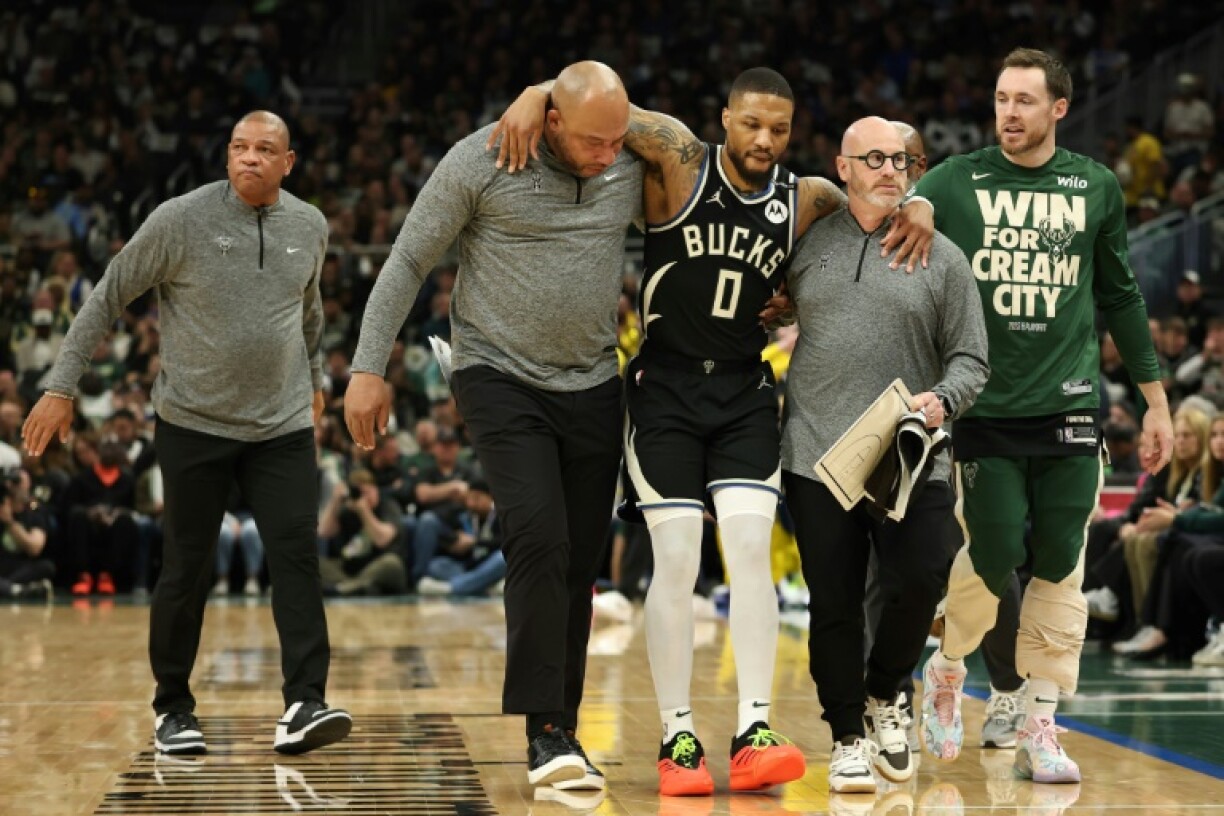 Damian Lillard limps out of Milwaukee's playoff defeat to Indiana; the NBA star has reportedly suffered a torn Achilles tendon