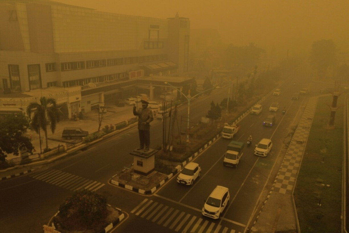 An aerial view shows thick smoke and haze from forest and land fires in the region in Palangkaraya, Central Kalimantan, on October 15, 2026. Toxic haze has covered parts of Indonesia, Malaysia and Singapore for weeks as Jakarta struggles to contain fires that have scorched large tracts of Borneo and Sumatra, with the smoke drifting across the region.
