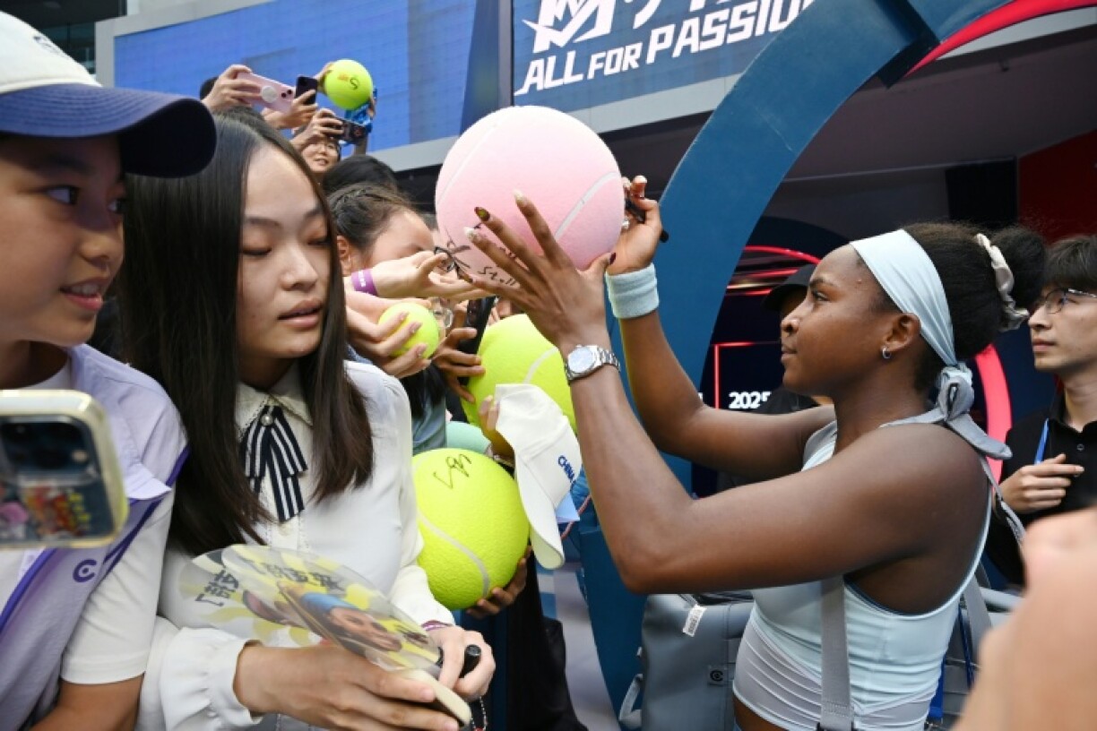 Coco Gauff signs autographs after winning her quarter-final match
