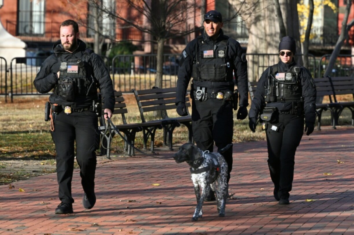 Secret Service uniformed division officers patrol in Lafayette Square across from the White House, in Washington, DC