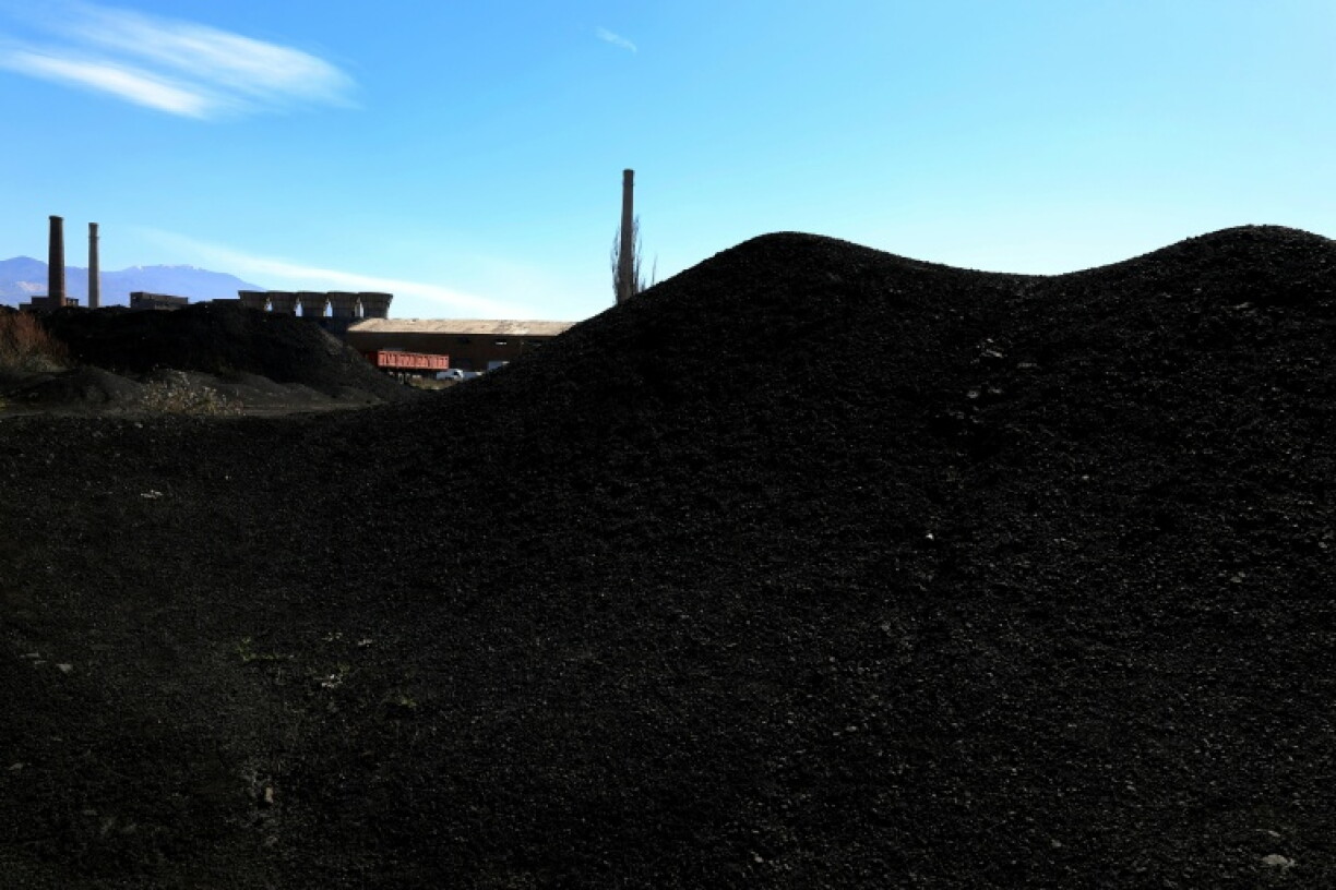 Hills of soot-black waste dot the landscape around the Elbasan steelworks complex
