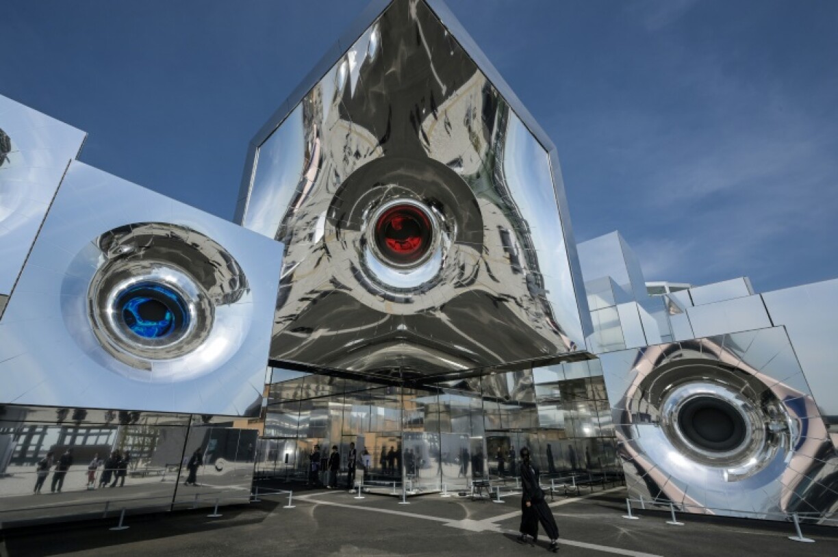 A woman (R) walks into the