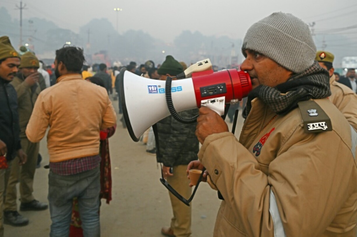 Officials were strolling the festival with loudhailers pleading with pilgrims to keep away from the disaster site