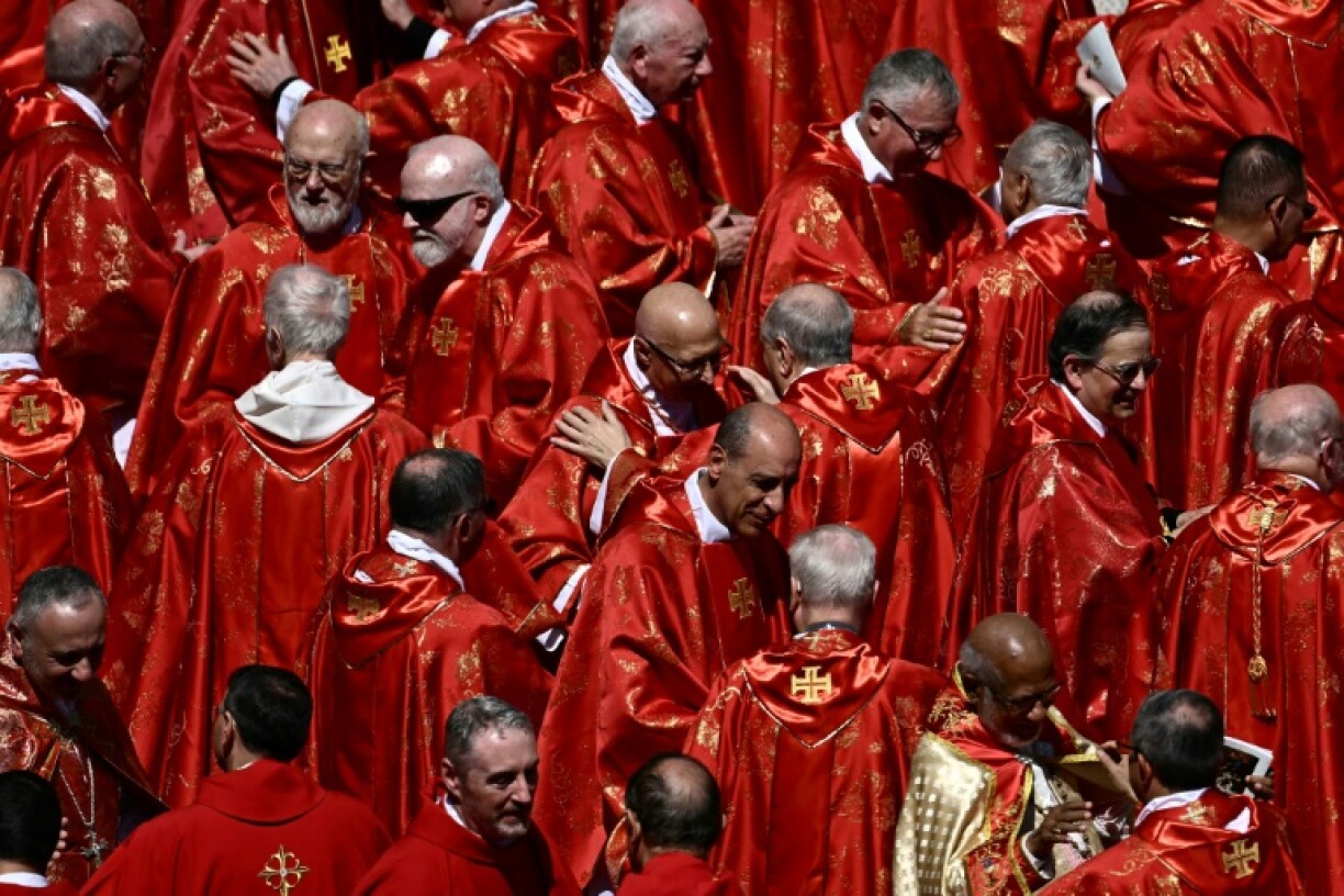 Cardinals embraced after Pope Francis's funeral ceremony in St Peter's Square at the Vatican